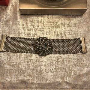 Silver tone, clear stone in the center of a silver medallion bracelet